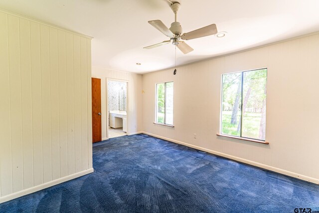 unfurnished room with ceiling fan, baseboards, and carpet floors