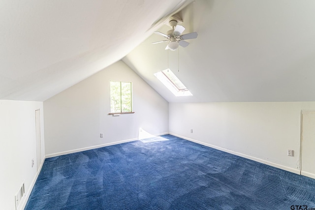 bonus room featuring carpet flooring, a ceiling fan, visible vents, and lofted ceiling with skylight