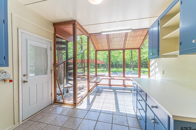 entryway with light tile patterned floors