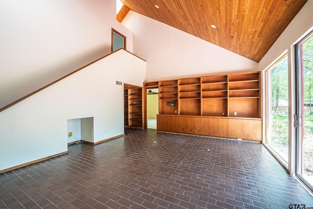 unfurnished living room featuring wood ceiling, high vaulted ceiling, baseboards, and brick floor