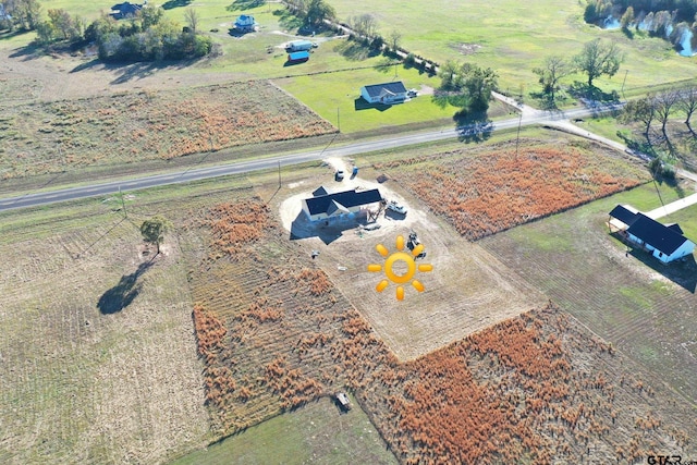 birds eye view of property featuring a rural view