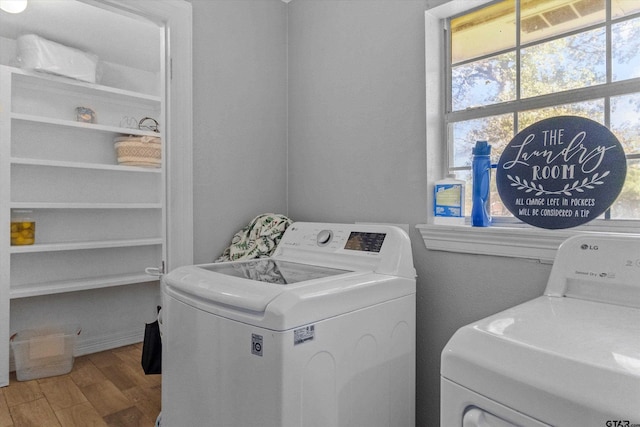 washroom featuring independent washer and dryer and wood-type flooring