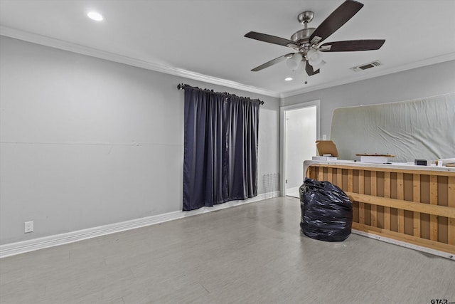 interior space featuring crown molding, ceiling fan, and wood-type flooring