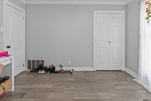 bedroom featuring light wood-type flooring and ornamental molding