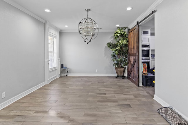 unfurnished dining area with light wood-type flooring, a barn door, ornamental molding, and a notable chandelier