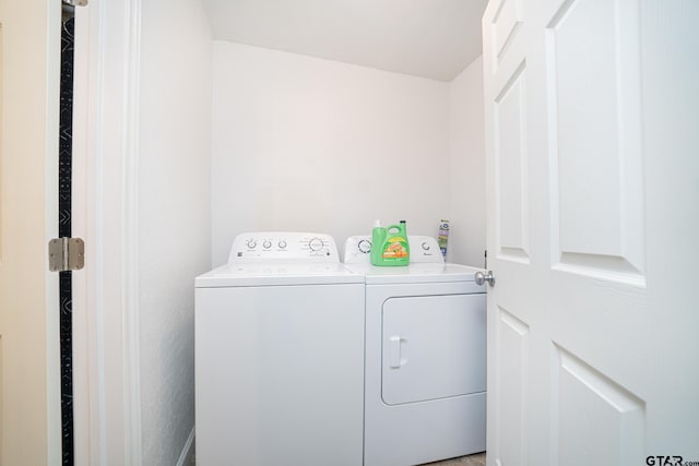 laundry room with washing machine and dryer