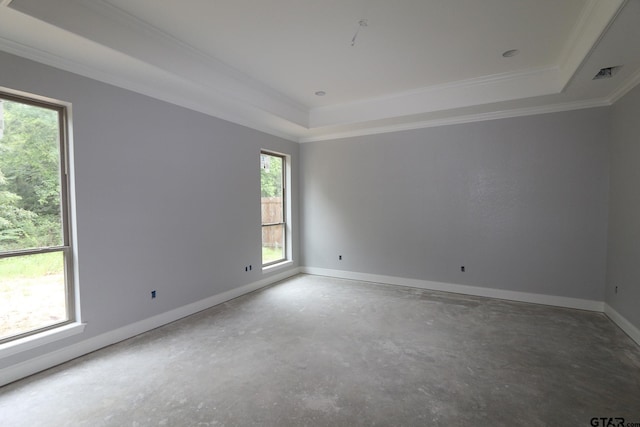 11941 Gillian Ct, Tyler, TX 75703 - unfurnished room with crown molding, a raised ceiling, baseboards, and concrete floors