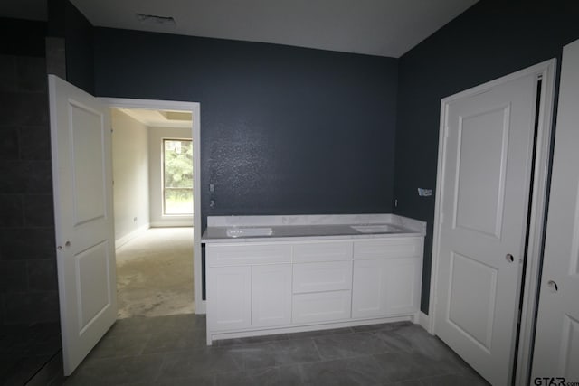 11941 Gillian Ct, Tyler, TX 75703 - spare room with baseboards and dark tile patterned floors
