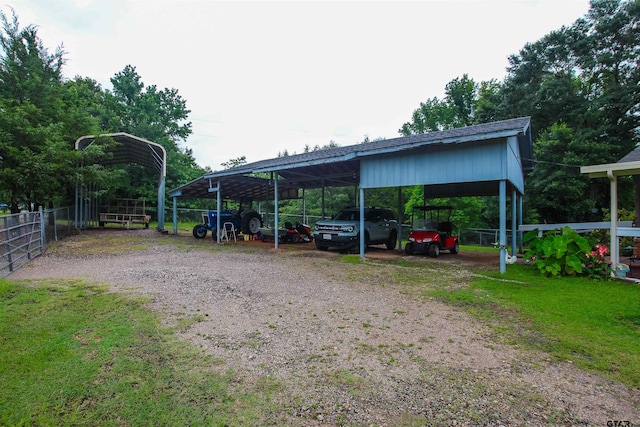 2391 Fm 16 W, Tyler, TX 75706 - view of parking with a detached carport and driveway