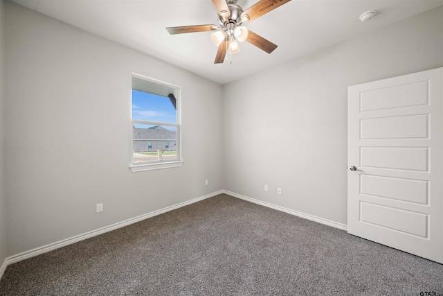 carpeted empty room featuring ceiling fan