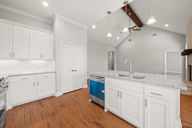 kitchen with light hardwood / wood-style flooring, white cabinets, sink, and stainless steel appliances