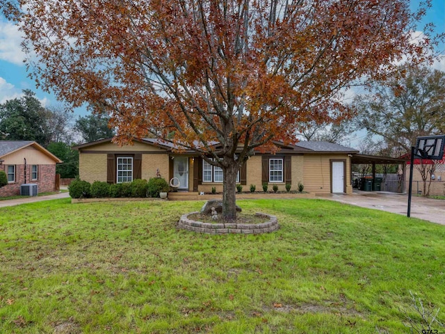 ranch-style house with central AC, a front lawn, and a carport