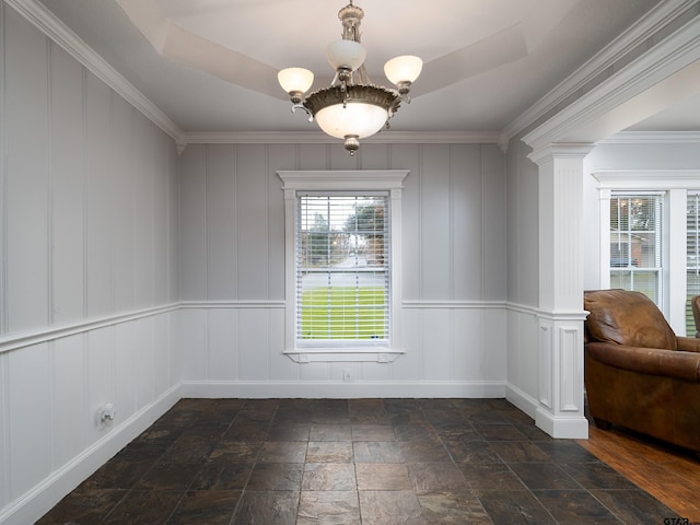 unfurnished dining area with crown molding and an inviting chandelier