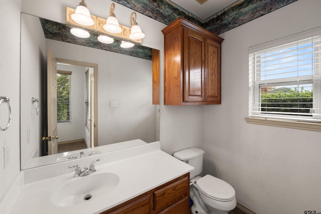 1745 County Road 1570, Alba, TX 75410 - bathroom with plenty of natural light, toilet, and vanity