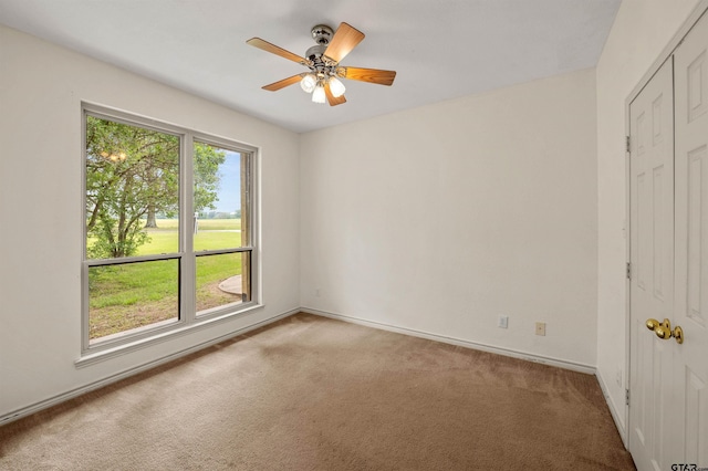 1745 County Road 1570, Alba, TX 75410 - unfurnished bedroom with light colored carpet, baseboards, a closet, and ceiling fan