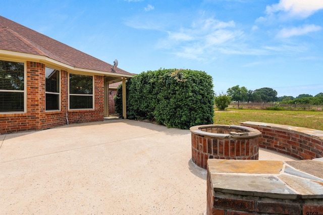 1745 County Road 1570, Alba, TX 75410 - view of patio / terrace with an outdoor fire pit