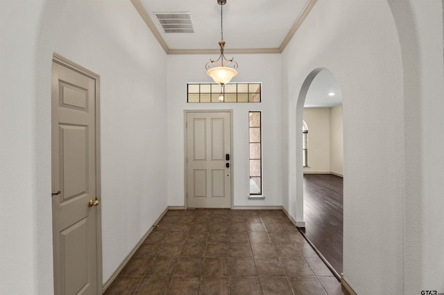 1745 County Road 1570, Alba, TX 75410 - foyer entrance featuring ornamental molding, arched walkways, and baseboards