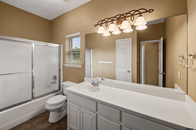 1745 County Road 1570, Alba, TX 75410 - full bathroom with toilet, vanity, bath / shower combo with glass door, tile patterned flooring, and a textured wall