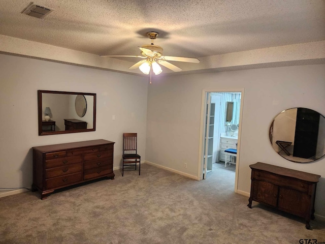 sitting room with visible vents, a ceiling fan, a textured ceiling, carpet floors, and baseboards