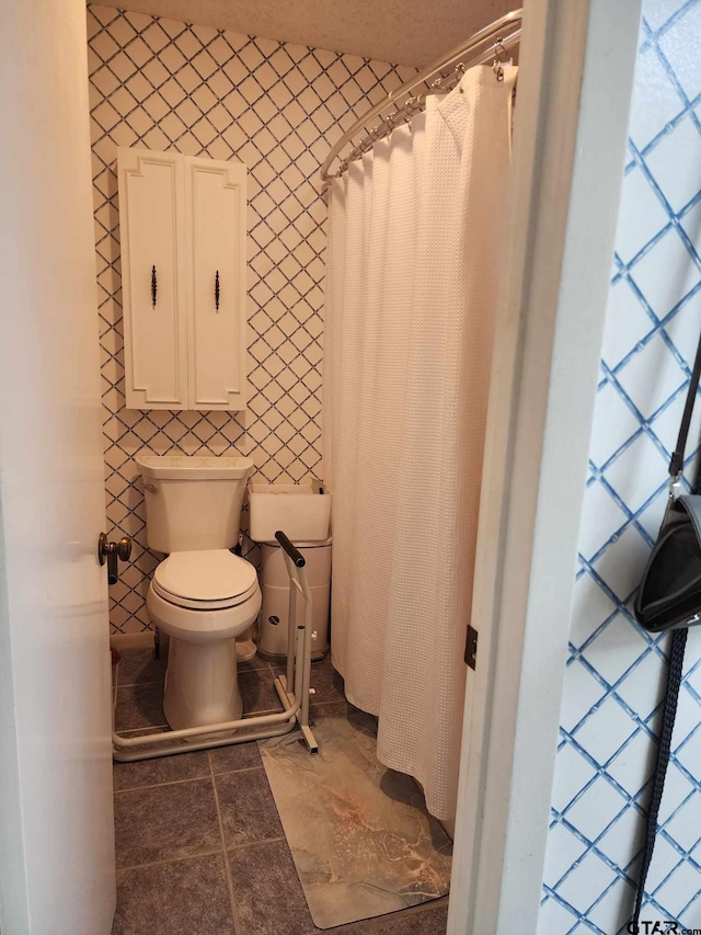 bathroom featuring tile patterned floors and toilet