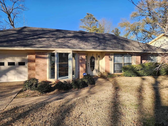 single story home featuring a garage