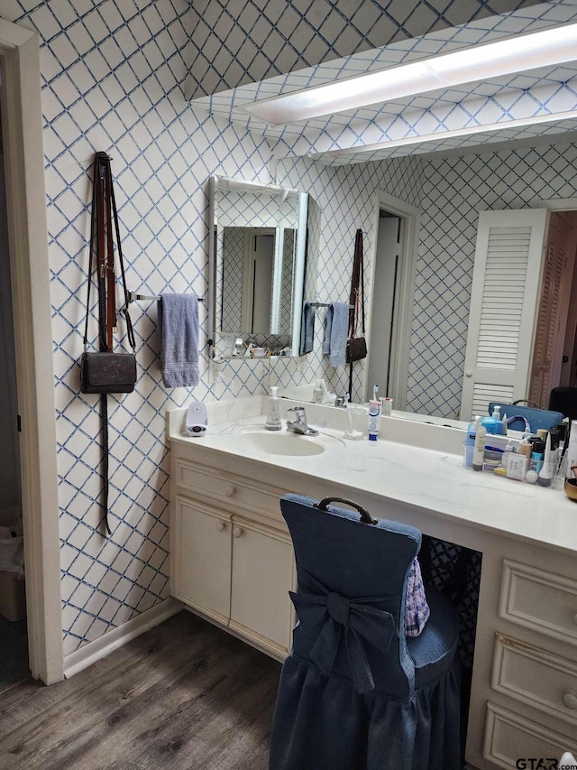 bathroom featuring vanity and hardwood / wood-style floors