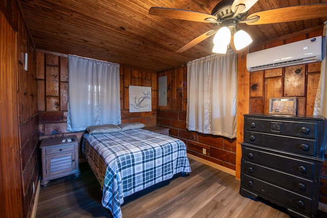 bedroom featuring ceiling fan, wooden ceiling, dark hardwood / wood-style flooring, a wall mounted AC, and wooden walls