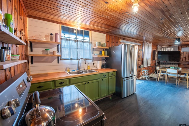 kitchen featuring appliances with stainless steel finishes, dark hardwood / wood-style floors, wood ceiling, and wood walls