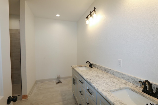 bathroom featuring hardwood / wood-style floors and vanity