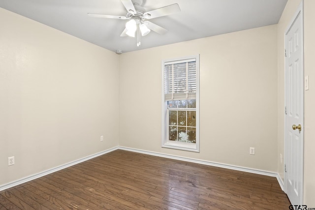 spare room featuring ceiling fan and dark hardwood / wood-style flooring