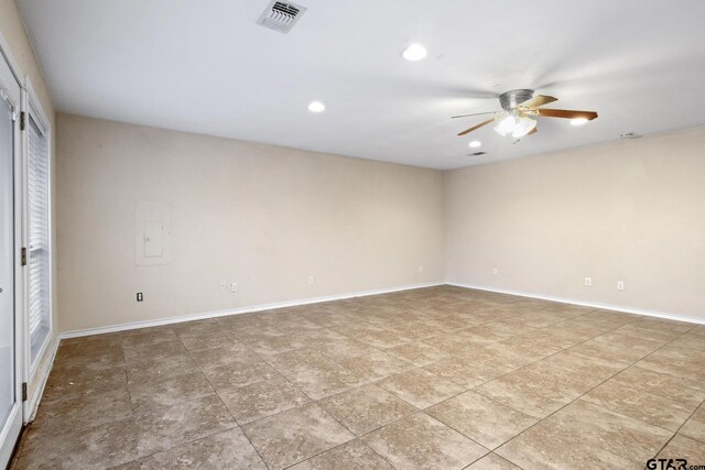 spare room with ceiling fan