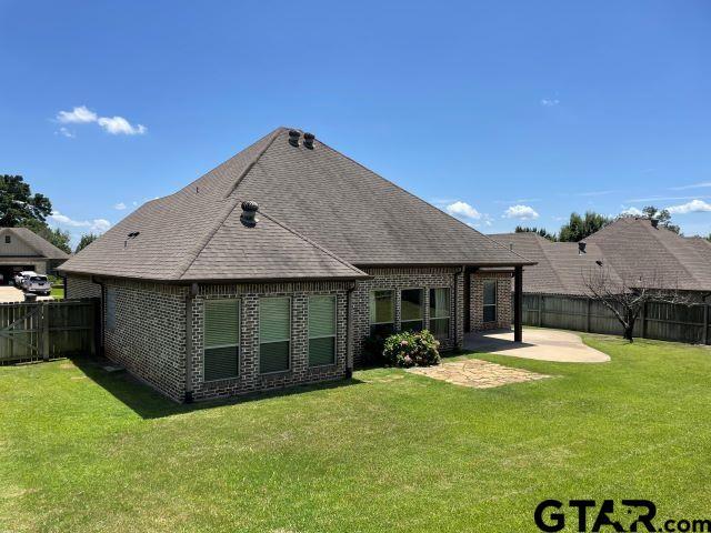 11200 Fox Trl, Flint, TX 75762 - back of house with brick siding, a fenced backyard, a patio, and a shingled roof