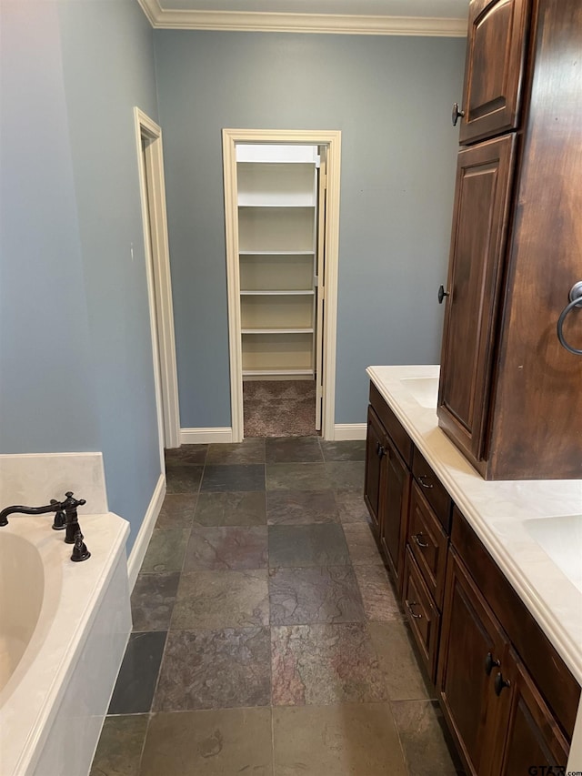 11200 Fox Trl, Flint, TX 75762 - full bath featuring a bath, crown molding, stone finish flooring, double vanity, and a spacious closet