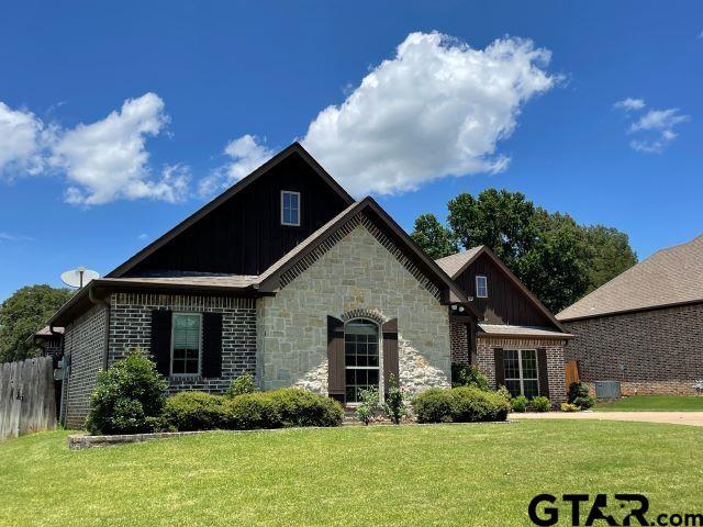 11200 Fox Trl, Flint, TX 75762 - view of front of house featuring board and batten siding, brick siding, and stone siding