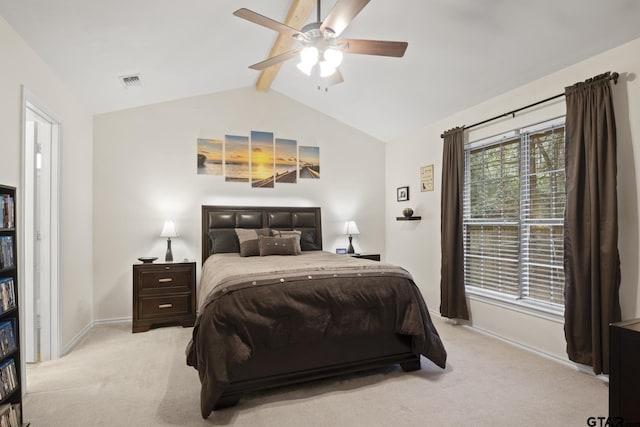 bedroom with vaulted ceiling with beams, ceiling fan, and light carpet