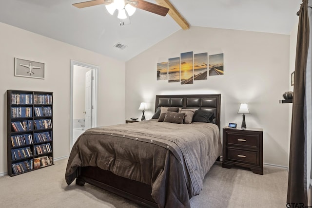 carpeted bedroom featuring vaulted ceiling with beams, ensuite bathroom, and ceiling fan