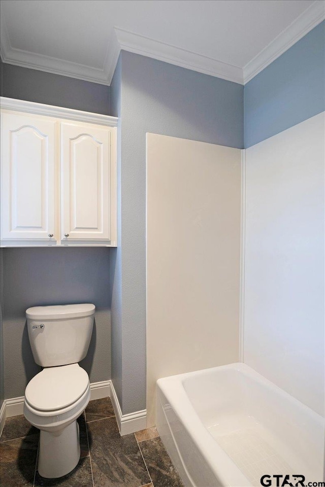 bathroom with a washtub, toilet, and ornamental molding