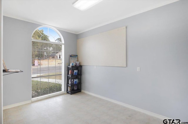 unfurnished room featuring ornamental molding