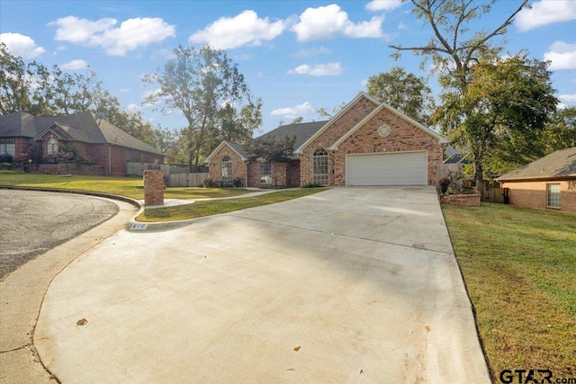 view of front of home with a front lawn and a garage