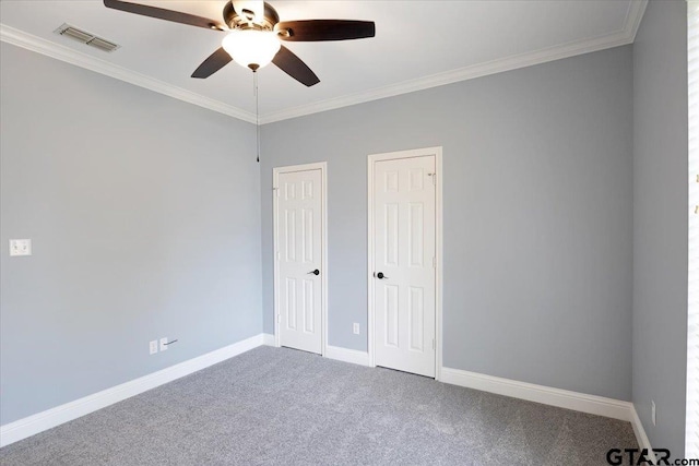 unfurnished bedroom featuring ceiling fan, carpet, and ornamental molding