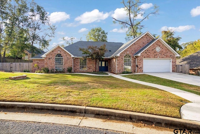 view of front of property with a front lawn and a garage