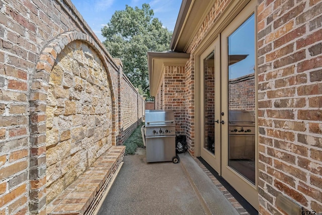 view of patio / terrace with area for grilling and french doors