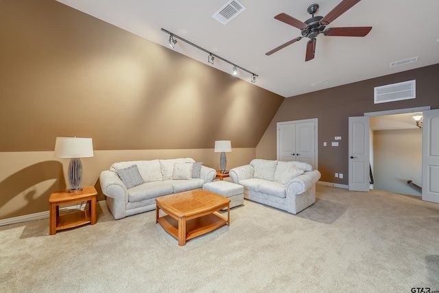 living room with ceiling fan, light colored carpet, and vaulted ceiling