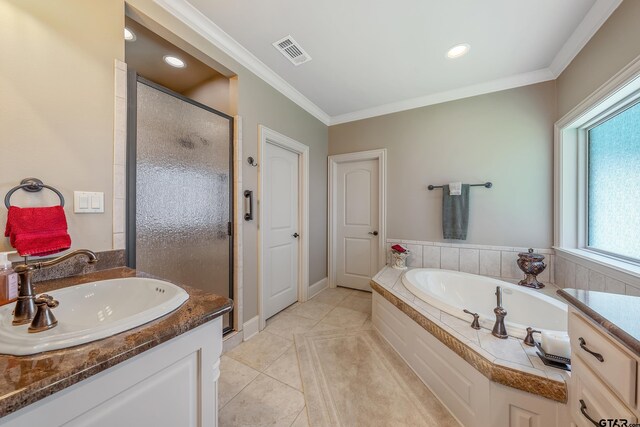 bathroom with tile patterned floors, crown molding, vanity, and independent shower and bath