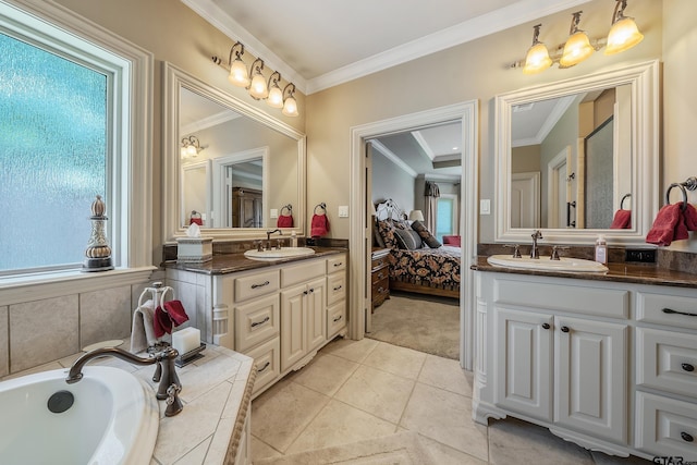 bathroom with tile patterned floors, tiled bath, crown molding, and vanity