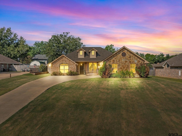 view of front of home with a lawn