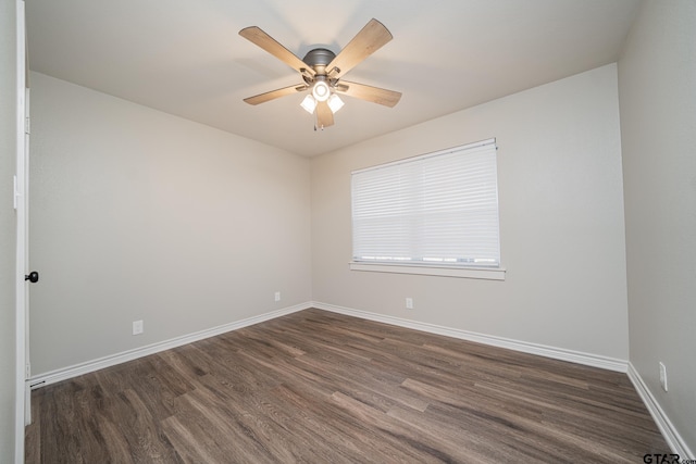 unfurnished room featuring ceiling fan and dark wood-type flooring