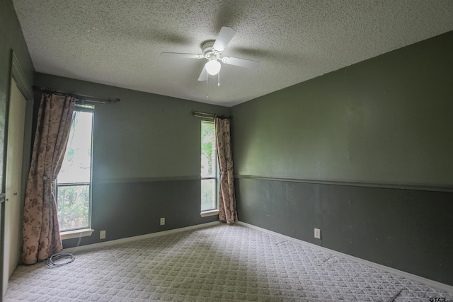 107 Clover Dr, Gun Barrel City, TX 75156 - carpeted spare room featuring a ceiling fan, a textured ceiling, and baseboards