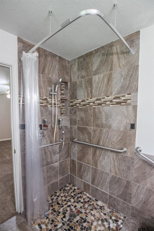 107 Clover Dr, Gun Barrel City, TX 75156 - full bathroom featuring a shower stall and a textured ceiling