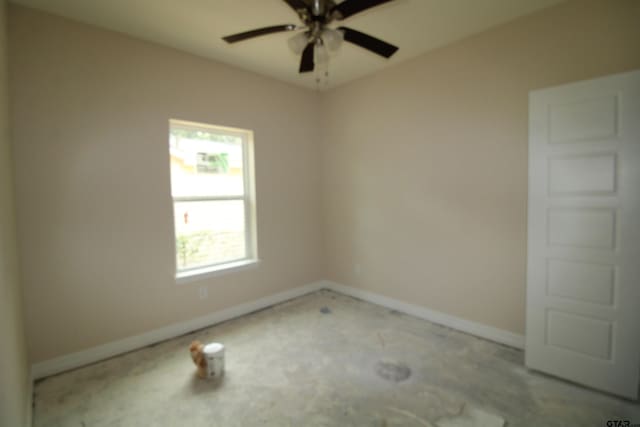 1209 S Butler Ave, Tyler, TX 75701 - empty room with baseboards and a ceiling fan